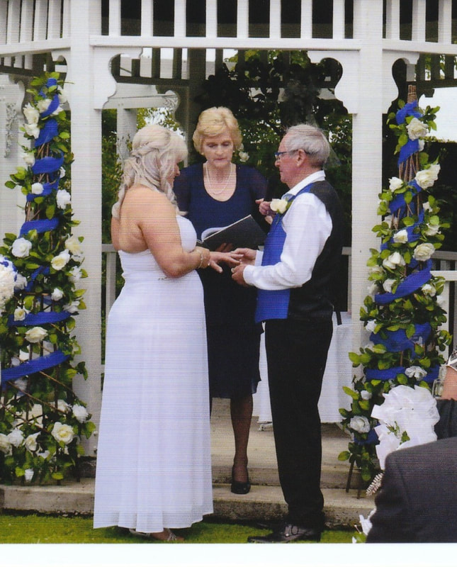 Helen with Susan and Neville exchanging rings